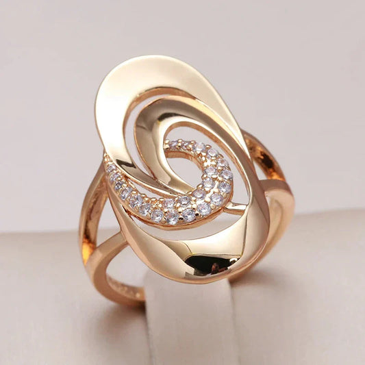 Elegant Spiral Gold Ring with Zirconia Radiance - Petra