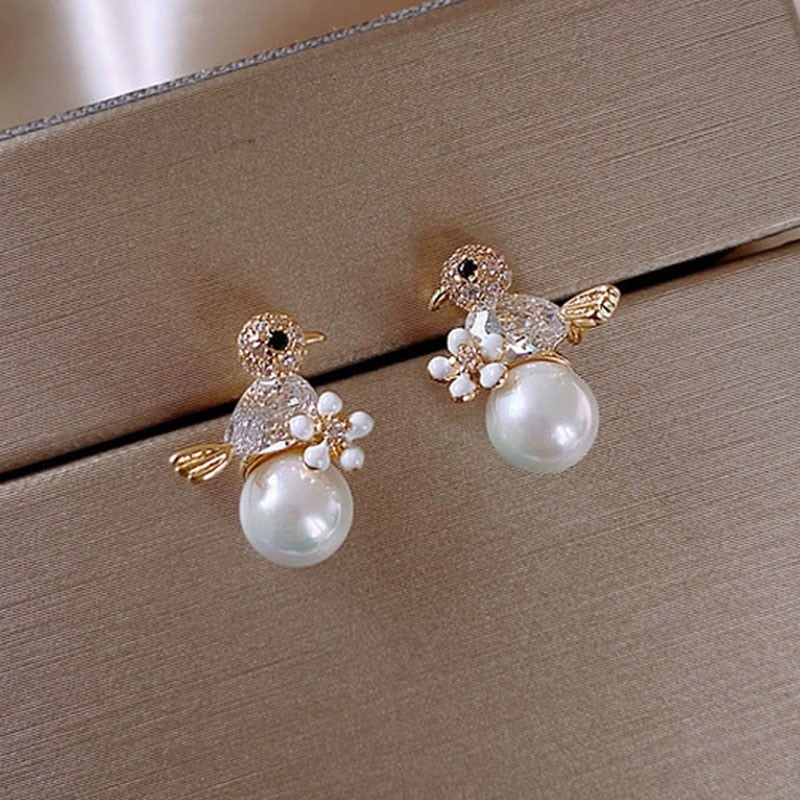 Elegant Cubic Zirconia sparkle and bewitching pearls - Birdie