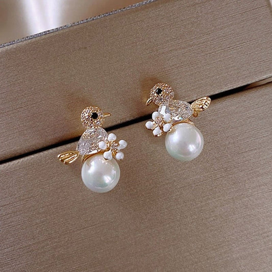 Elegant Cubic Zirconia sparkle and bewitching pearls - Birdie